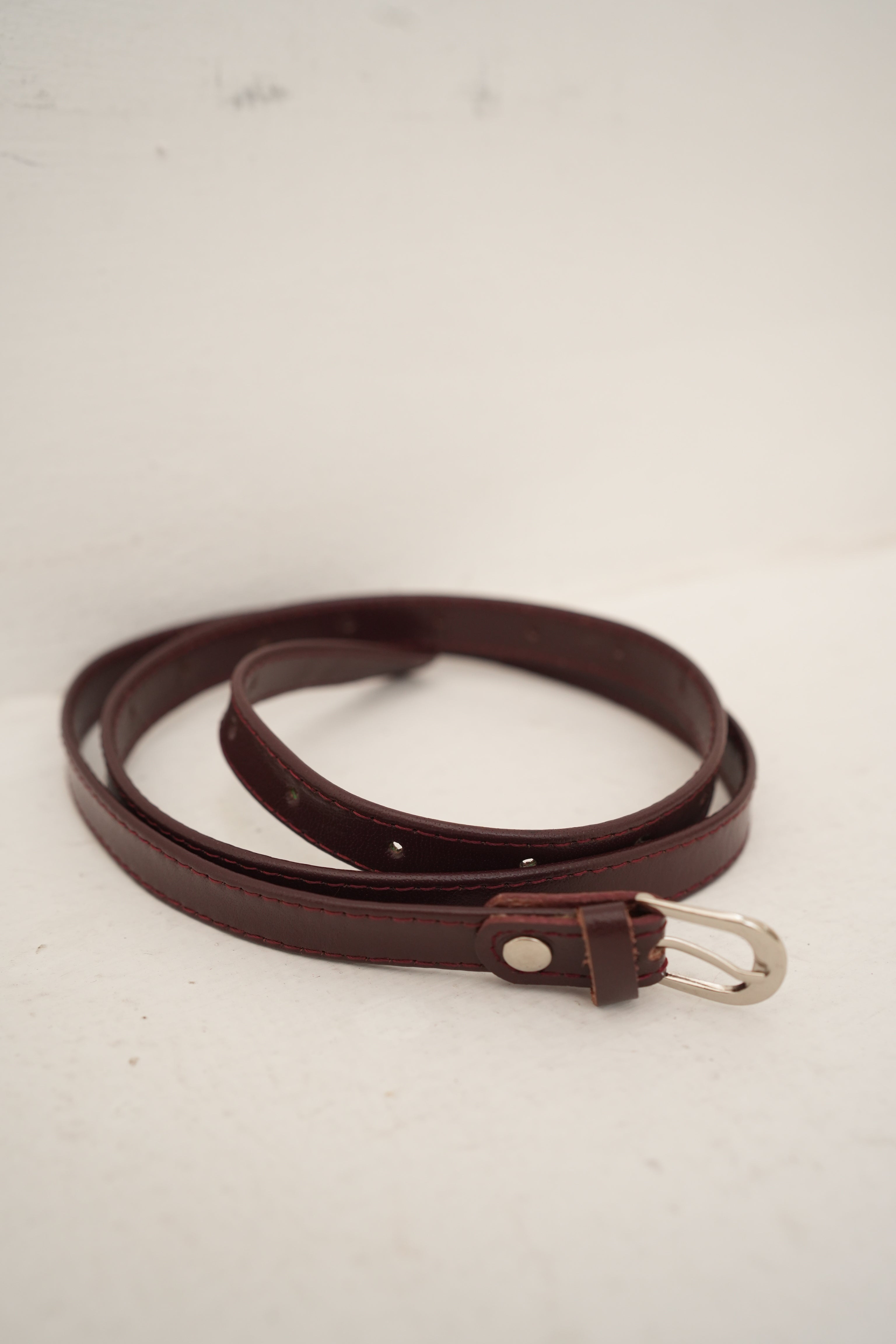 sleek dark brown belt silver buckle